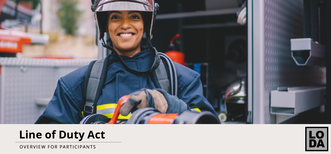 Rescue worker with helmet and firemen in the background.